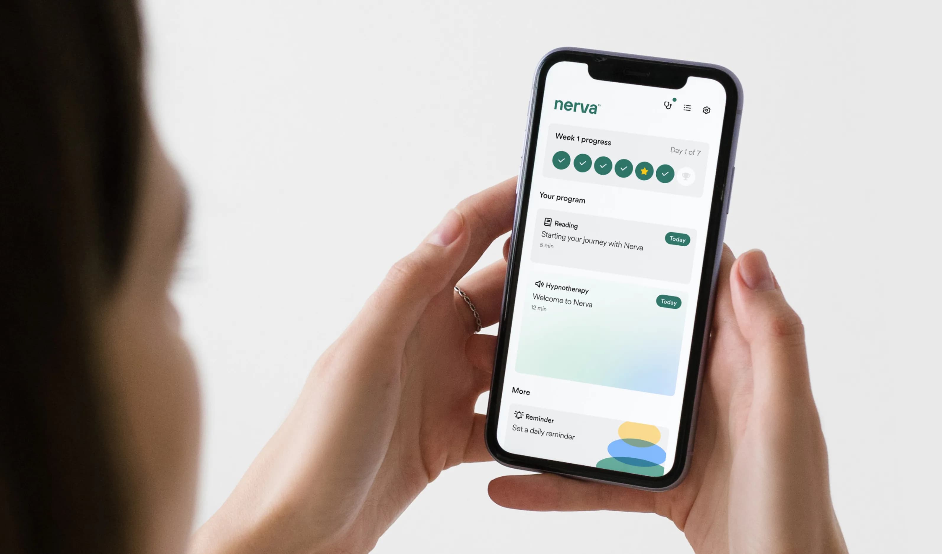 A person holding a phone showing Nerva's weekly progress, reading and hypnotherapy session cards.