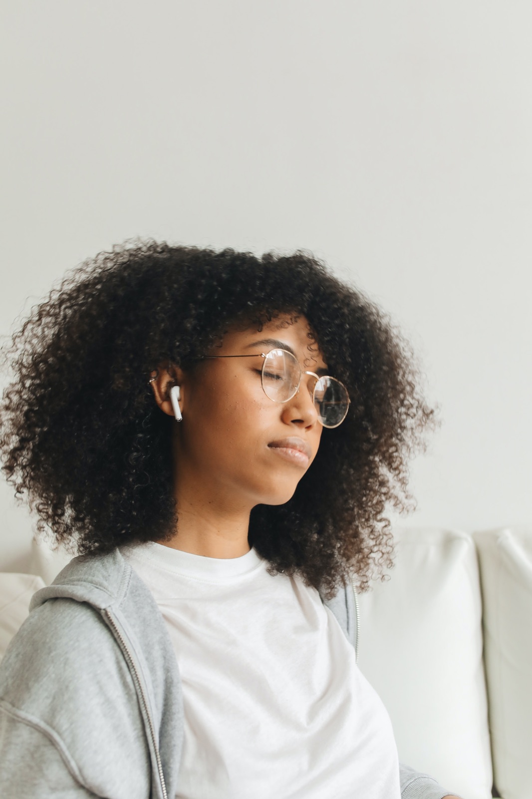 A person listening to a guided audio session